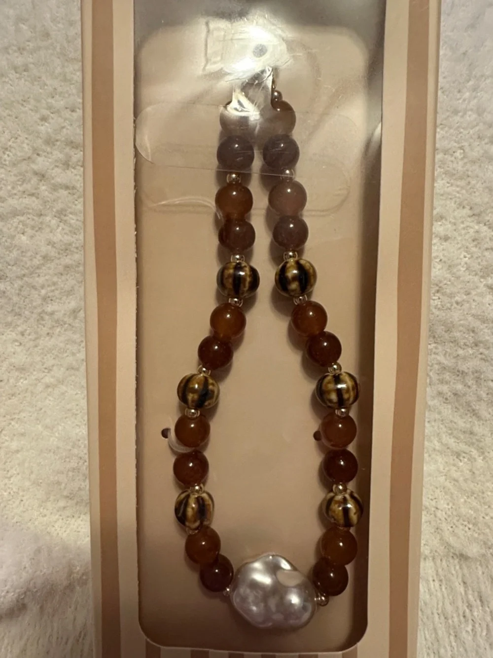 nOir Jewelry Brown and Gold Beaded Phone Chain with Pearl Accent